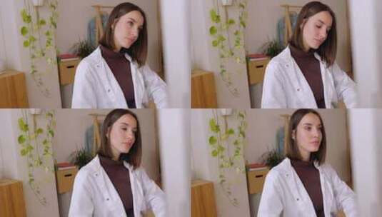 年轻女医生在诊室工作的肖像高清在线视频素材下载