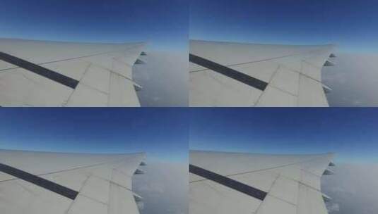 在蓝天中飞行的飞机机翼12高清在线视频素材下载
