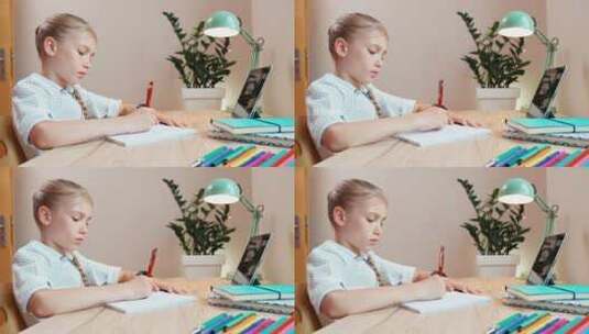 小女孩坐在桌前写作业高清在线视频素材下载