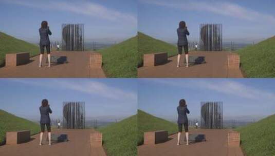 女人在拍摄纪念馆高清在线视频素材下载