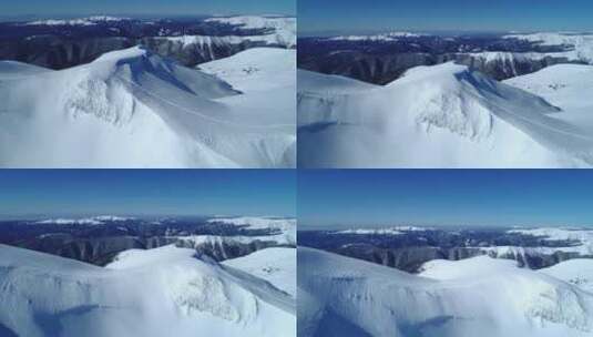 在白雪皑皑的山脉上空缓缓飞行高清在线视频素材下载