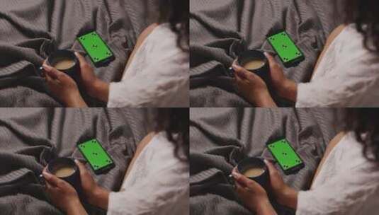 女人在床上看绿屏手机高清在线视频素材下载