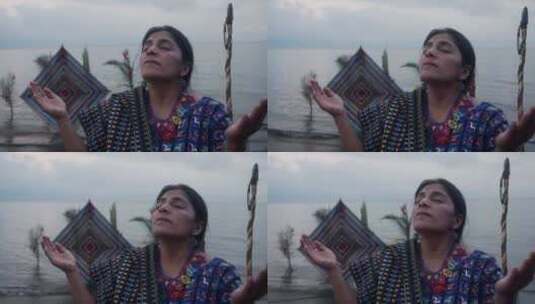 土著女人在海边祈祷高清在线视频素材下载