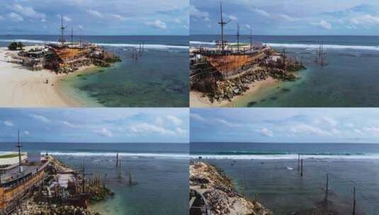 2.7K巴厘岛海滩上的废弃船只高清在线视频素材下载
