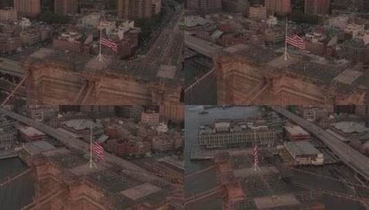 美国航空：布鲁克林大桥上空的美国国旗和曼哈顿东河景特写圆环飞行高清在线视频素材下载