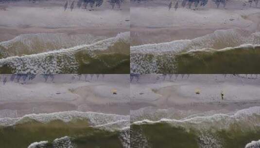 从空中俯瞰海湾水波撞击海滩的白色沙滩高清在线视频素材下载