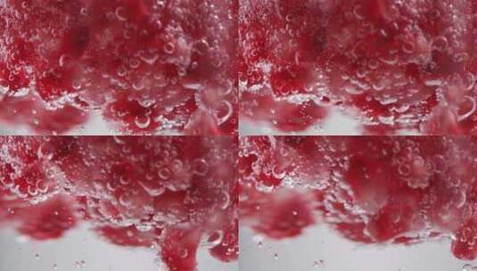 气泡水/雪碧中的石榴籽 4k慢镜头高清在线视频素材下载