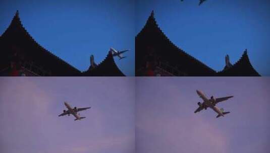 实拍飞机从古楼头顶飞过高清在线视频素材下载