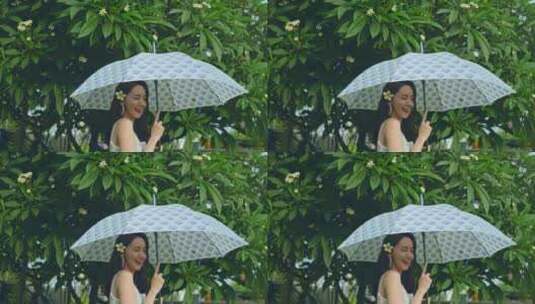 美女雨中打伞升格高清在线视频素材下载