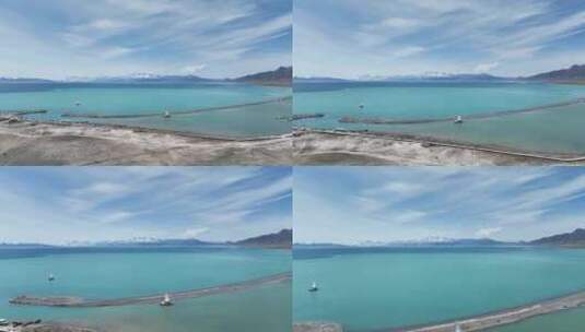 航拍新疆赛里木湖碧绿色湖水和蓝色湖水交汇高清在线视频素材下载