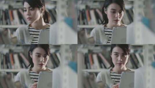 一个女孩站在图书馆里看书高清在线视频素材下载