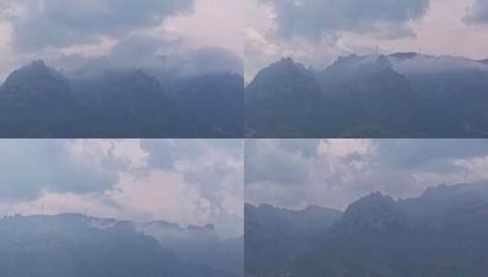 延时山巅山峰云雾缭绕山巅大风车若隐若现高清在线视频素材下载