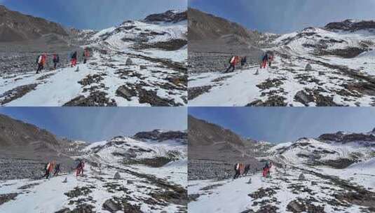 攀登岷山山脉主峰雪宝顶雪山的登山队高清在线视频素材下载