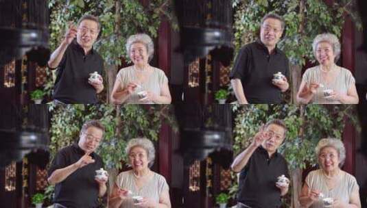 幸福的老年夫妇喝茶聊天高清在线视频素材下载