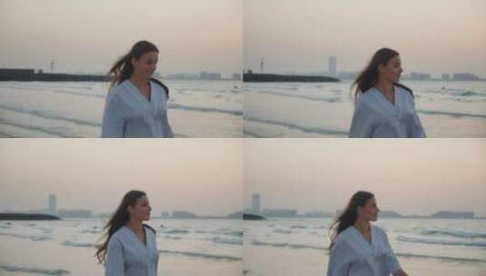 女人在海边看日落散步高清在线视频素材下载