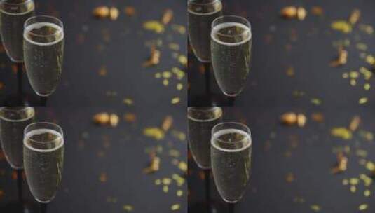 两杯满是金色装饰的起泡香槟酒高清在线视频素材下载