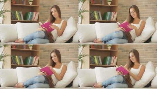 女孩坐在沙发上看书 高清在线视频素材下载