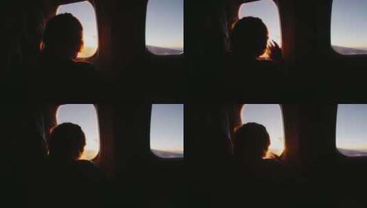 女孩坐在飞机上看着窗外升起的太阳高清在线视频素材下载
