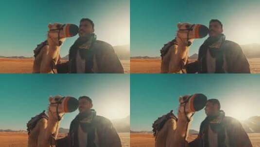 男人牵着骆驼在沙漠中高清在线视频素材下载