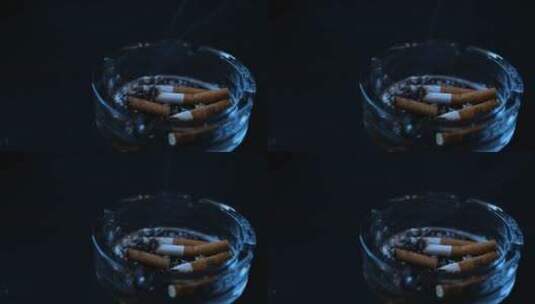 烟灰缸里的燃烧的香烟高清在线视频素材下载