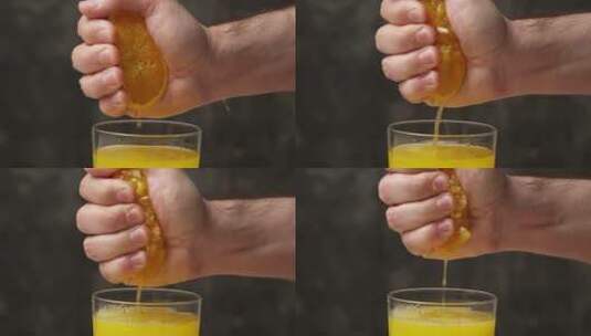 用手挤橙子到杯子里高清在线视频素材下载