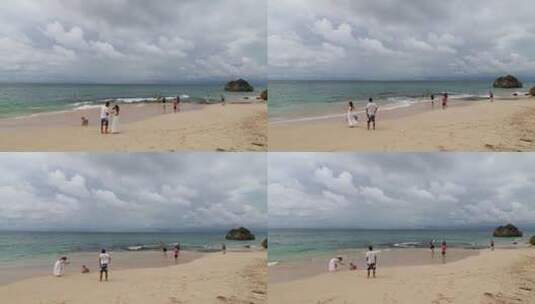 巴厘亚洲人岛晴天海滩沙滩人群玩耍度假高清在线视频素材下载