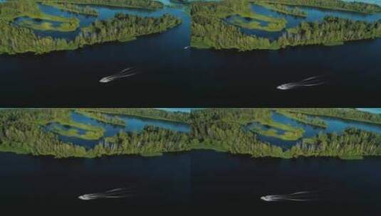 湿地公园上空拍摄汽艇再湖面飞速行驶高清在线视频素材下载