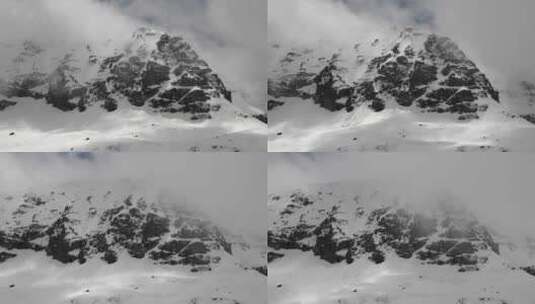 多云冬季的高海拔岩石雪穹顶山峰高清在线视频素材下载