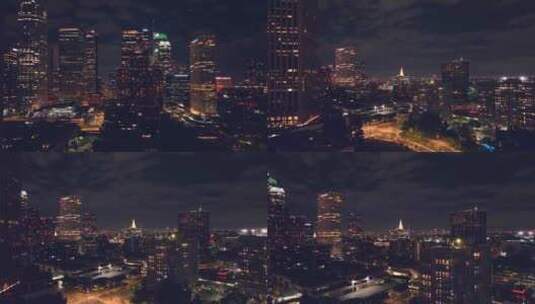 航拍洛杉矶市中心摩天大楼夜景灯光汽车街道高清在线视频素材下载