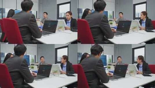 亚洲年轻商人团体讨论会议关于办公室机器人高清在线视频素材下载