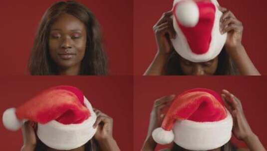 年轻女人戴圣诞帽高清在线视频素材下载