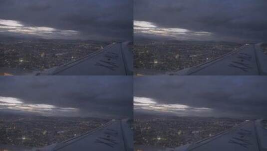 夜间飞越城市上空的飞机高清在线视频素材下载