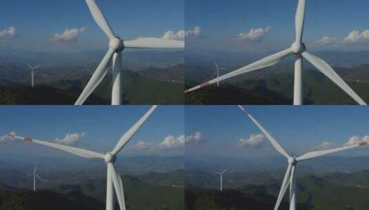 航拍蓝天白云下的风力发电机特写高清在线视频素材下载