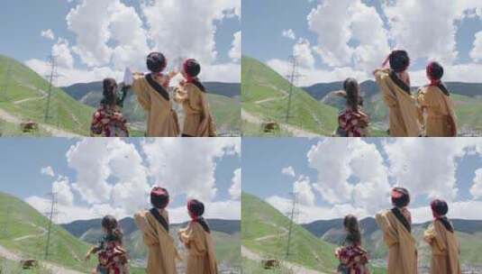 三个藏族儿童在山顶放飞纸飞机高清在线视频素材下载