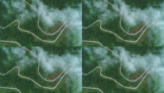 夏日九顶山云雾缭绕高角度航拍山路盘旋弯曲高清在线视频素材下载