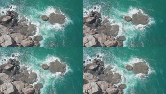 航拍视角浪花拍打在礁石上高清在线视频素材下载