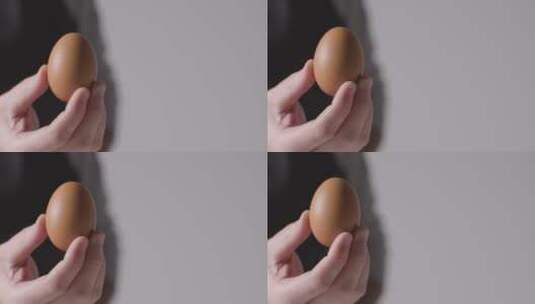 手拿着一颗鸡蛋高清在线视频素材下载