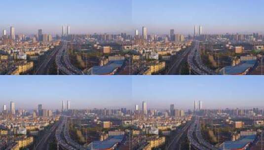 中国云南昆明双子塔和高架桥车流黄昏风光高清在线视频素材下载