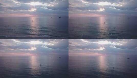 日落时分平静大海一个人划桨高清在线视频素材下载