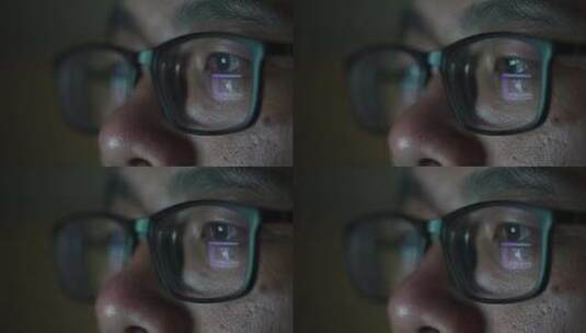 戴眼镜的男子晚上加班在电脑前工作高清在线视频素材下载