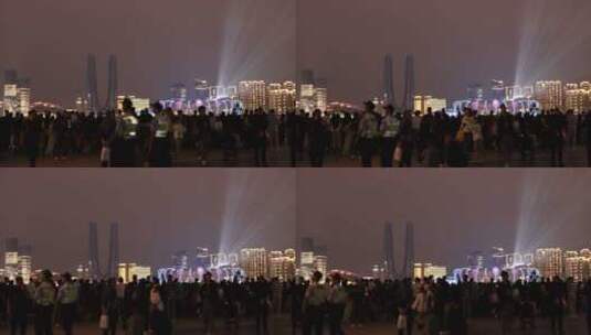 人们在城市阳台观看亚运会开幕式灯光秀高清在线视频素材下载