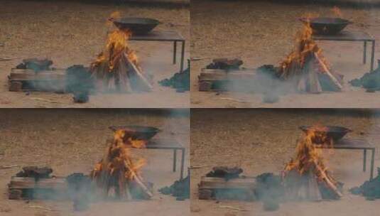 燃烧的木头：火舌和余烬烟雾的慢动作视频。高清在线视频素材下载