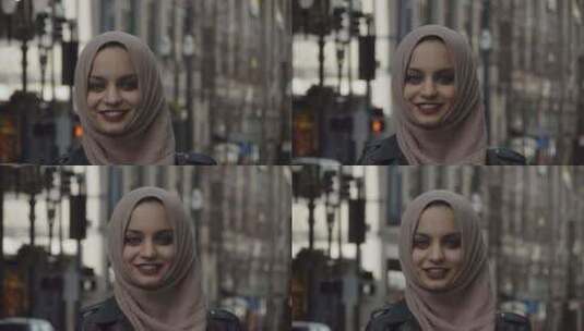 戴头巾的穆斯林妇女对着镜头微笑高清在线视频素材下载