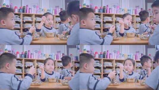 幼儿园的小孩子吃饭的镜头高清在线视频素材下载