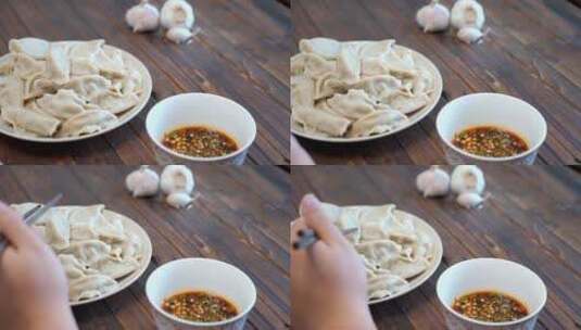 中餐美食饺子蘸上调料高清在线视频素材下载