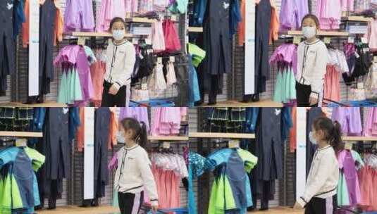 独自在商场选购商品的东方女孩高清在线视频素材下载