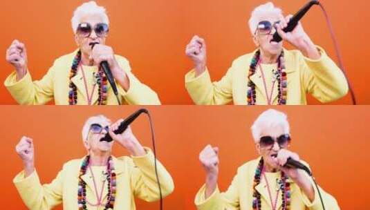 老年女性拿着麦克风演唱高清在线视频素材下载