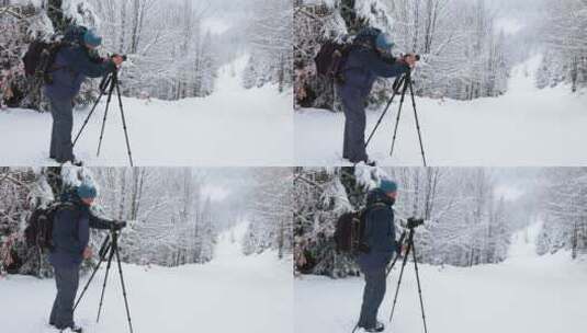 摄影师在森林雪地调试摄影机高清在线视频素材下载