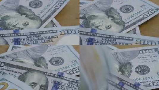 100美元钞票掉到桌子上高清在线视频素材下载