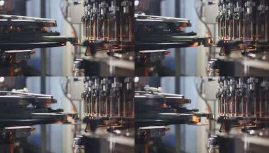 工厂生产装瓶的自动装置高清在线视频素材下载